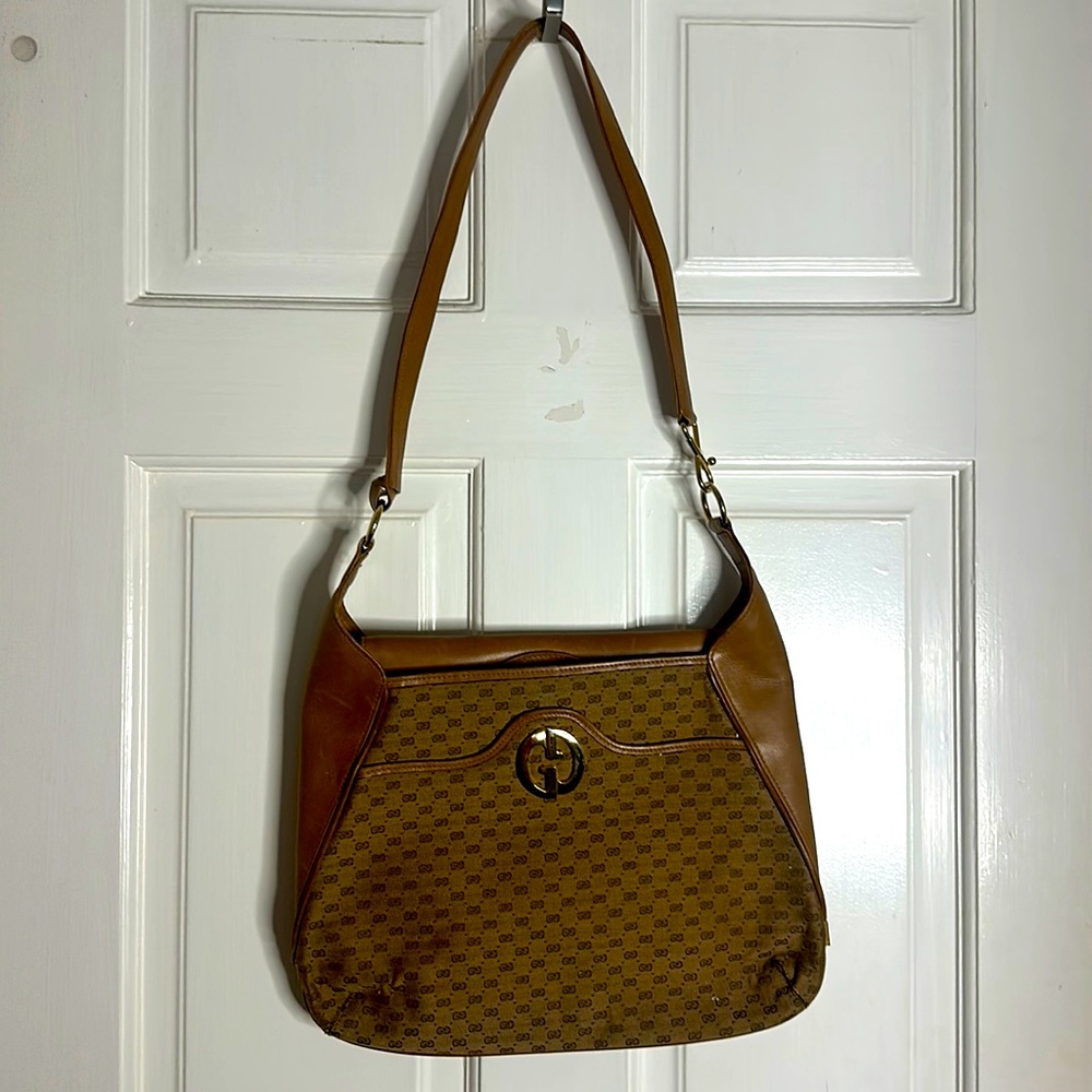 Vintage Gucci purse over shoulder gold hardware